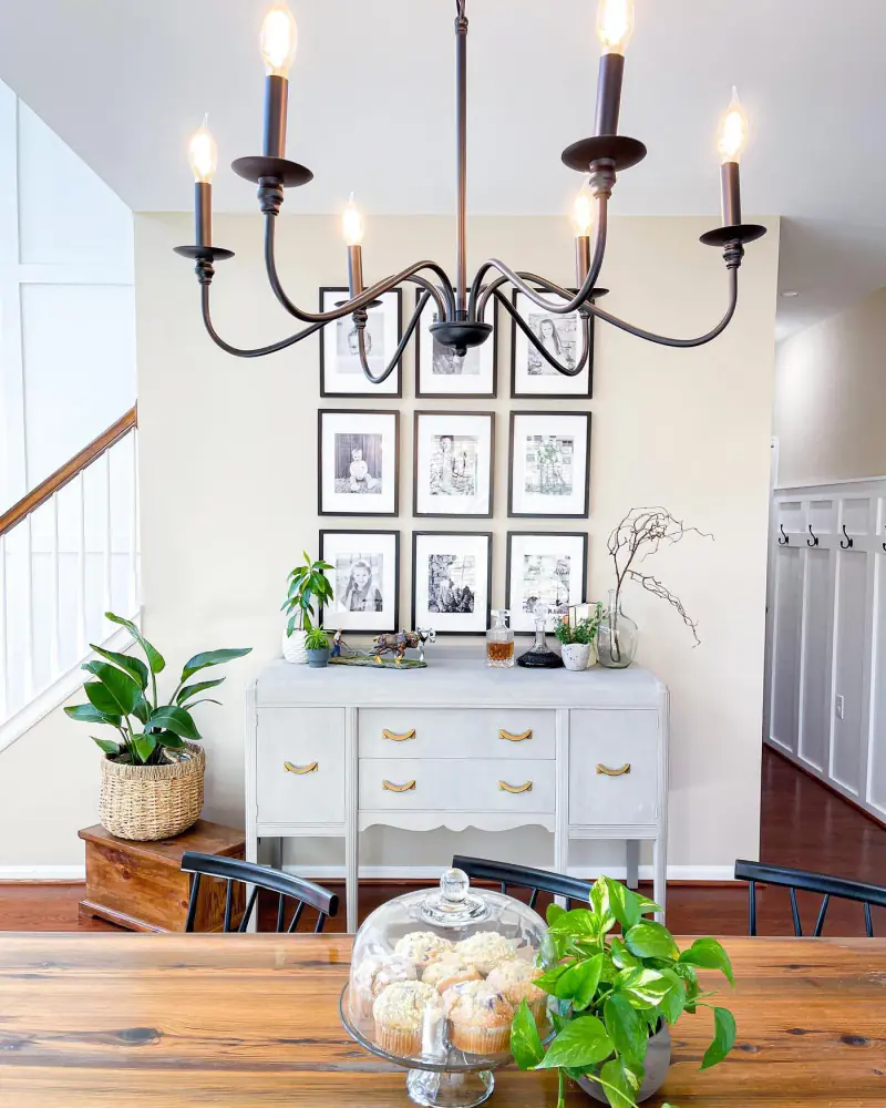 Console with chandelier and gallery wall